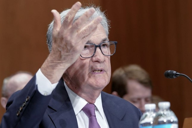 Fed chair tries to project calm as financial problems continue to mount